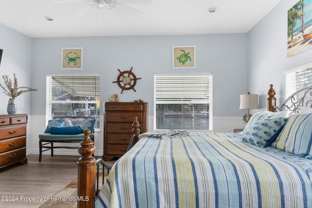 bedroom featuring hardwood / wood-style floors and ceiling fan