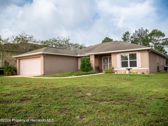 single story home featuring a front yard and a garage