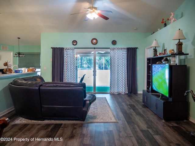 living room with vaulted ceiling, ceiling fan, and dark hardwood / wood-style floors