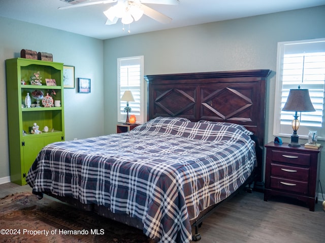 bedroom featuring ceiling fan and hardwood / wood-style flooring