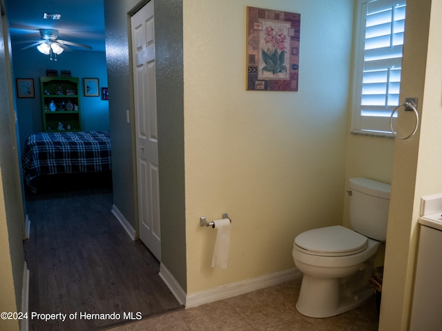 bathroom with ceiling fan, wood-type flooring, and toilet