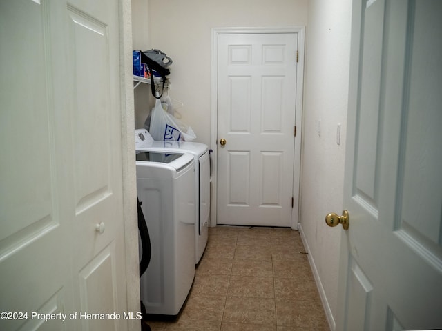 laundry area with light tile patterned flooring and independent washer and dryer