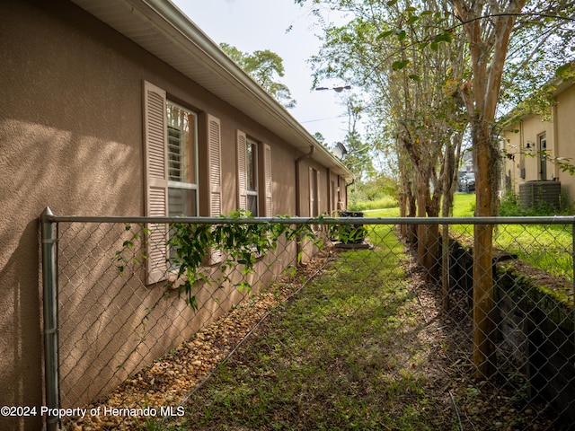 view of property exterior with a yard