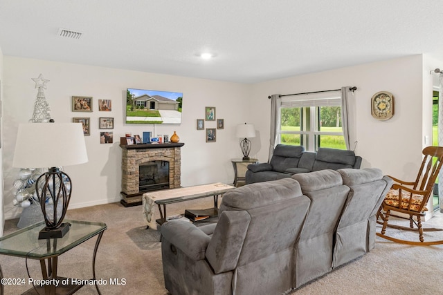 carpeted living room with a fireplace