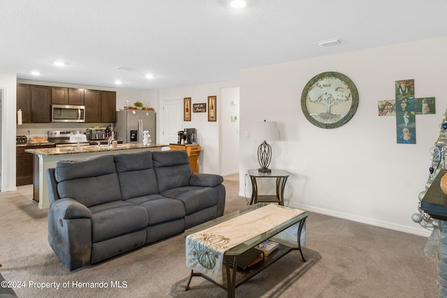 living room with light colored carpet