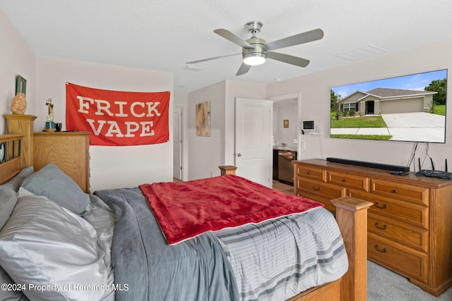 carpeted bedroom with ceiling fan