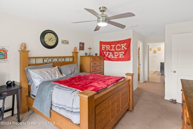 bedroom with light colored carpet and ceiling fan