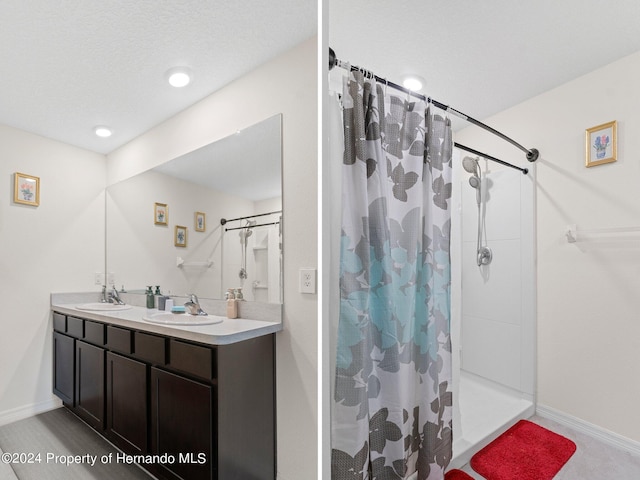 bathroom featuring a shower with curtain and vanity