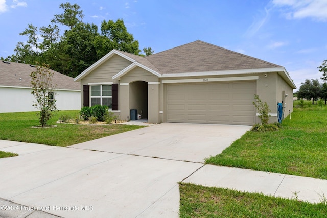 ranch-style house with a front lawn and a garage