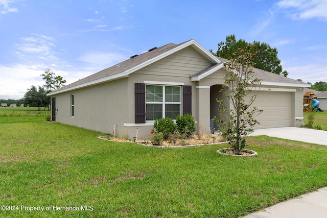 single story home with a garage and a front yard