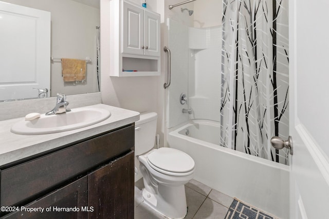 full bathroom featuring toilet, vanity, shower / bath combo with shower curtain, and tile patterned floors