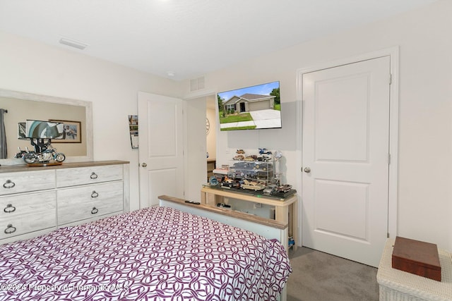 bedroom featuring light colored carpet