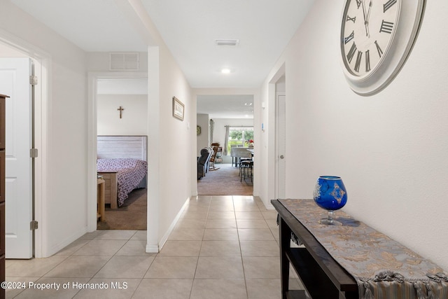 hallway with light tile patterned flooring