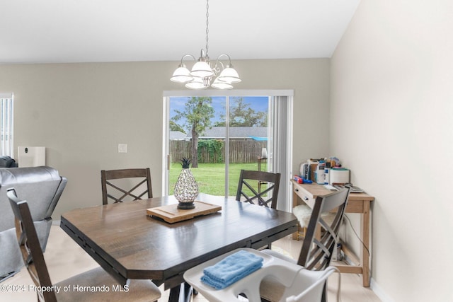 dining space featuring a notable chandelier