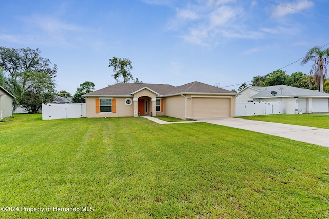 ranch-style house with a garage and a front lawn