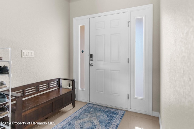 entrance foyer featuring light tile patterned flooring