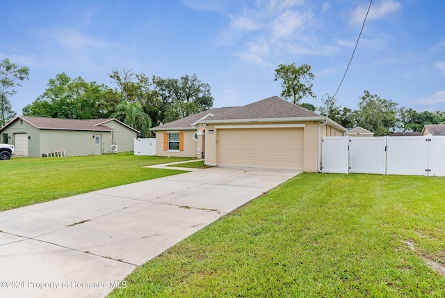 view of front of house featuring a front lawn and a garage