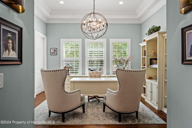 living area with plenty of natural light, wood-type flooring, crown molding, and a notable chandelier