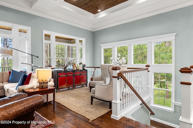 sitting room featuring wooden ceiling, a towering ceiling, dark hardwood / wood-style flooring, and ornamental molding