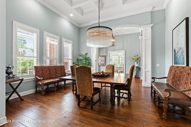 dining area featuring crown molding, dark hardwood / wood-style flooring, coffered ceiling, beamed ceiling, and a chandelier