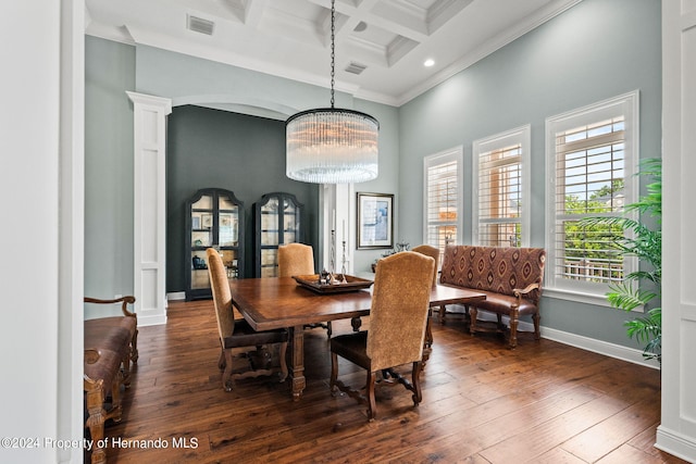 dining space with ornamental molding, a notable chandelier, ornate columns, coffered ceiling, and dark wood-type flooring