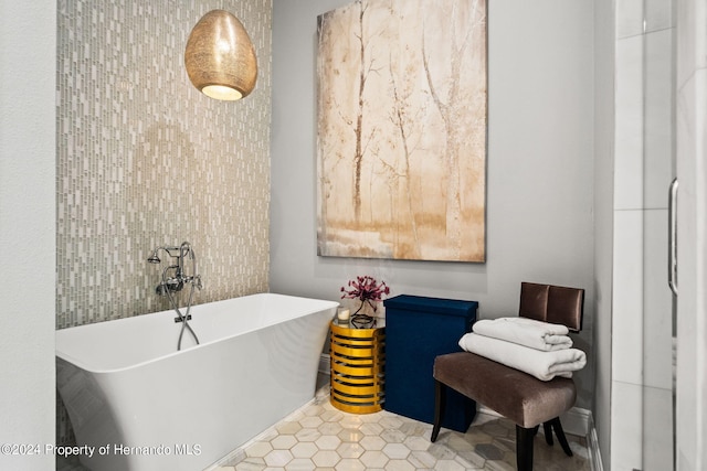 bathroom featuring tile patterned flooring and a washtub