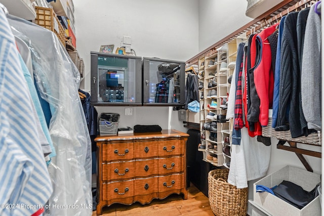 walk in closet featuring light hardwood / wood-style flooring