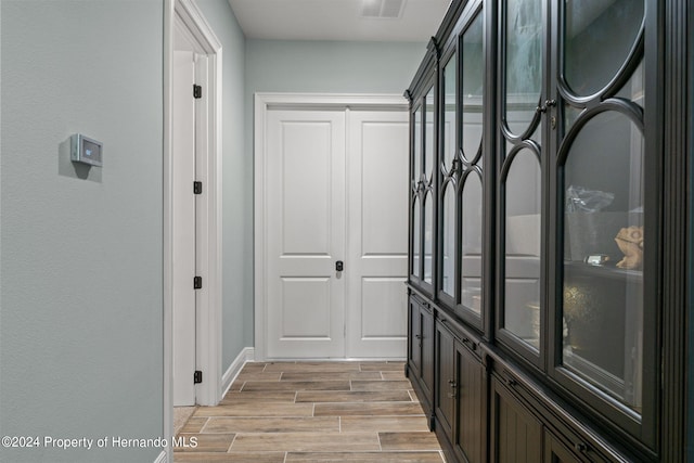 hallway with light wood-type flooring