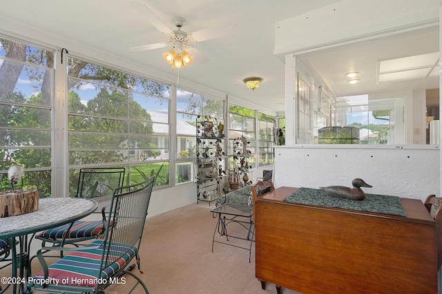 sunroom / solarium with ceiling fan