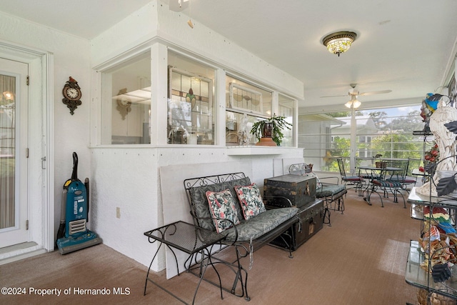 sunroom / solarium with ceiling fan