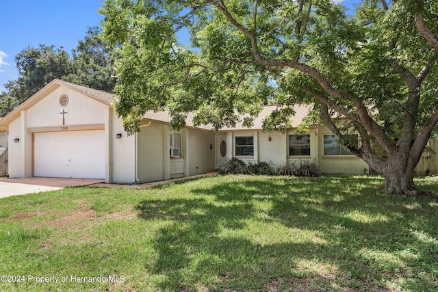 single story home with a garage and a front lawn