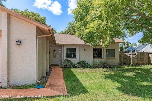 exterior space featuring a front lawn