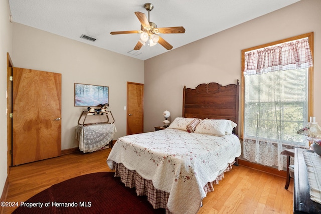 bedroom featuring light wood-type flooring and ceiling fan