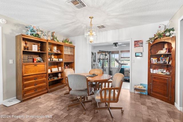 3391 Lambert Ave, Spring Hill, FL 34608 - dining room with ceiling fan and a textured ceiling