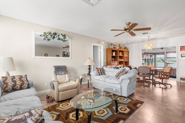 3391 Lambert Ave, Spring Hill, FL 34608 - living room featuring ceiling fan with notable chandelier and a textured ceiling