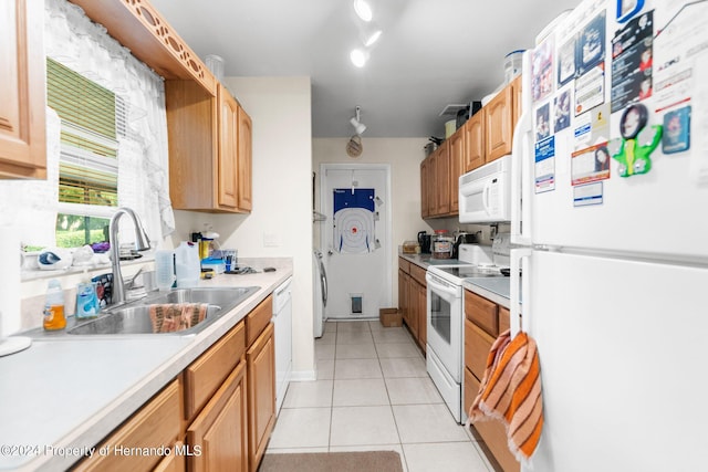 3391 Lambert Ave, Spring Hill, FL 34608 - kitchen featuring sink, white appliances, and light tile patterned floors