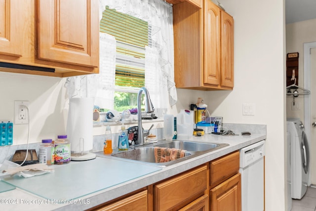 3391 Lambert Ave, Spring Hill, FL 34608 - kitchen with washer and clothes dryer, sink, and white dishwasher