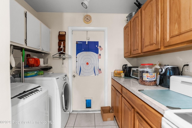 3391 Lambert Ave, Spring Hill, FL 34608 - clothes washing area with light tile patterned floors and washer and dryer