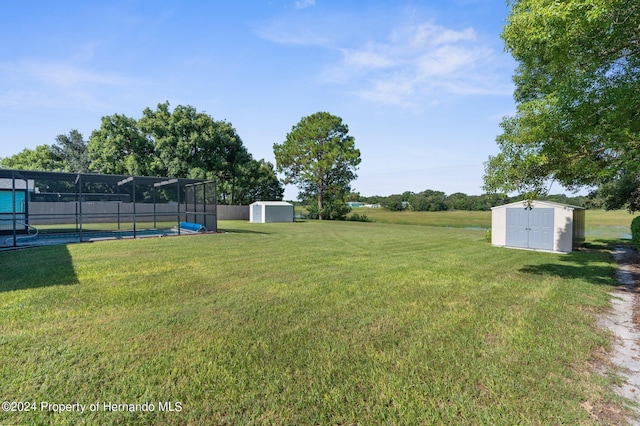 3391 Lambert Ave, Spring Hill, FL 34608 - view of yard featuring a pool and a storage shed