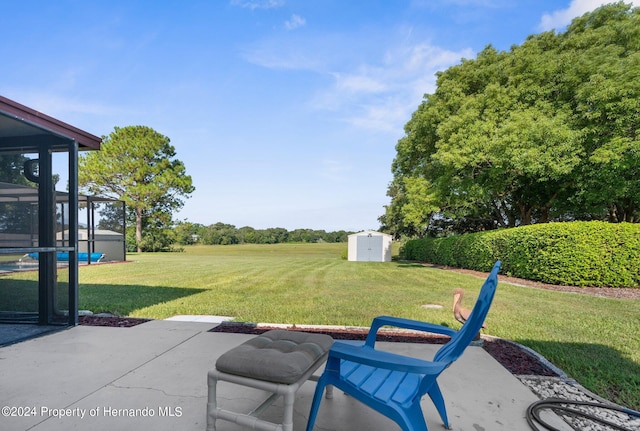 3391 Lambert Ave, Spring Hill, FL 34608 - view of patio / terrace featuring a storage shed and a sunroom