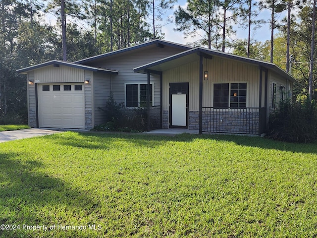 ranch-style home with a garage and a front yard