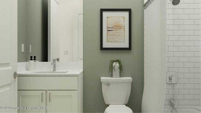 full bathroom featuring toilet, tiled shower / bath combo, and vanity