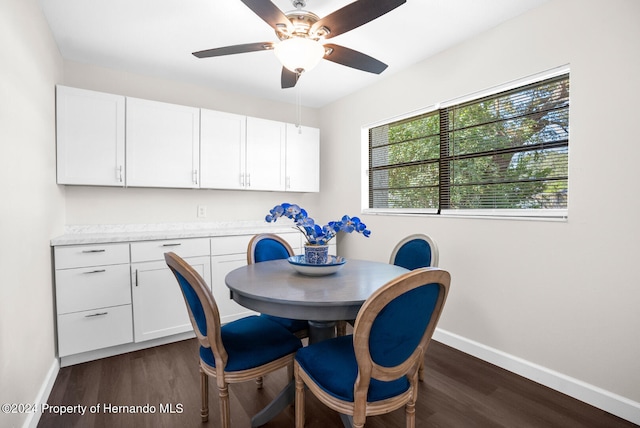 dining room featuring ceiling fan and dark hardwood / wood-style floors