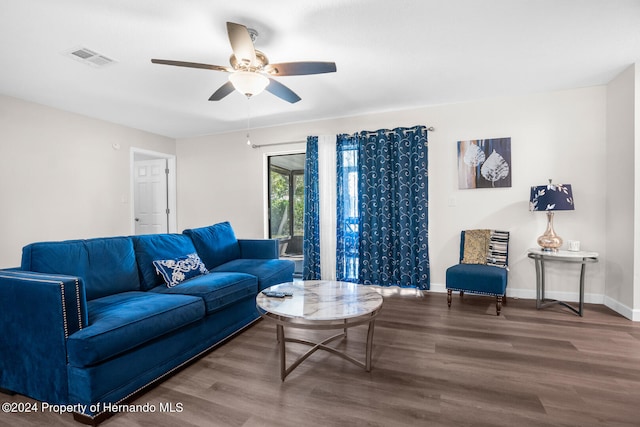 living room with hardwood / wood-style floors and ceiling fan