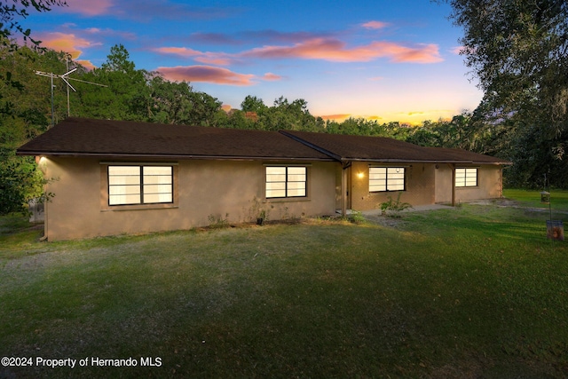 view of front of home featuring a lawn