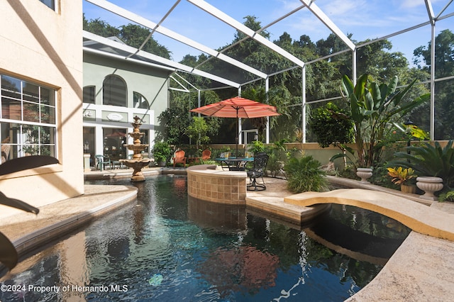 view of pool featuring a lanai and a patio area