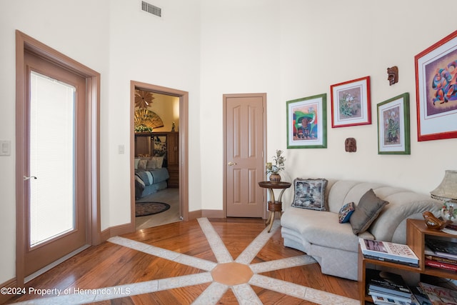 living room with light hardwood / wood-style flooring and a healthy amount of sunlight