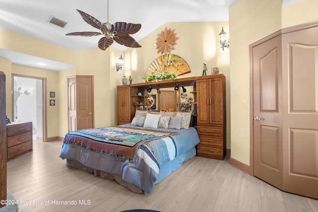 bedroom with light hardwood / wood-style floors and ceiling fan