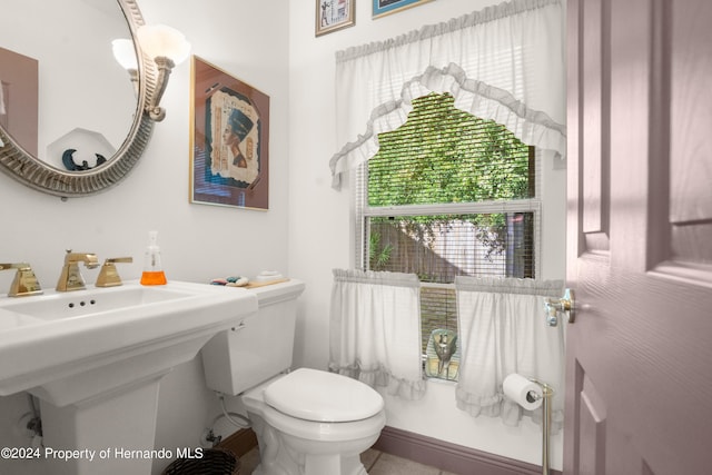 bathroom with sink and toilet