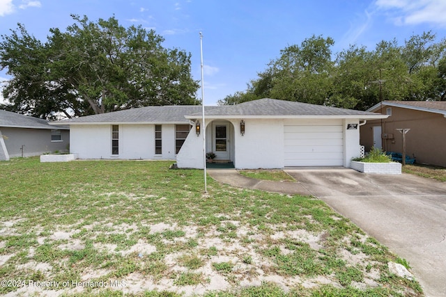 ranch-style home with a garage and a front yard